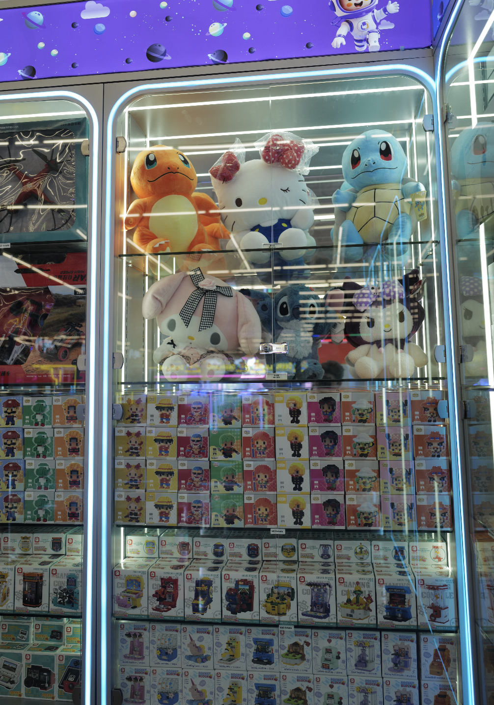 Prize wall stocked with Pokémon plush and toys